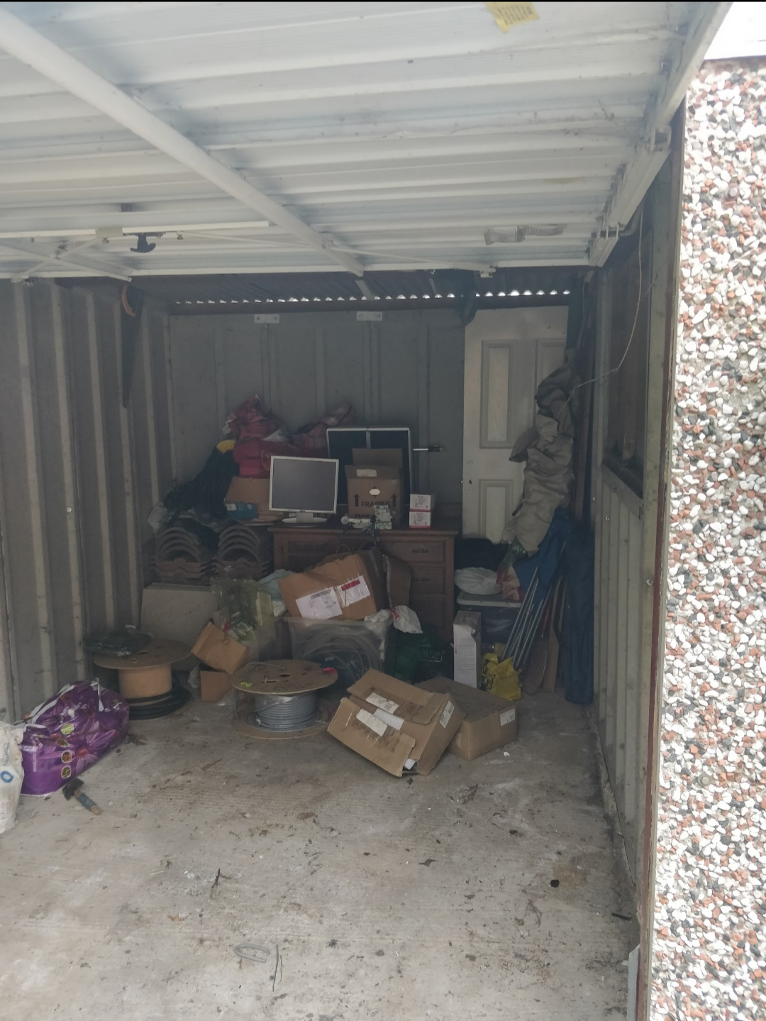 Inside the garage before conversion -- bare and unused
