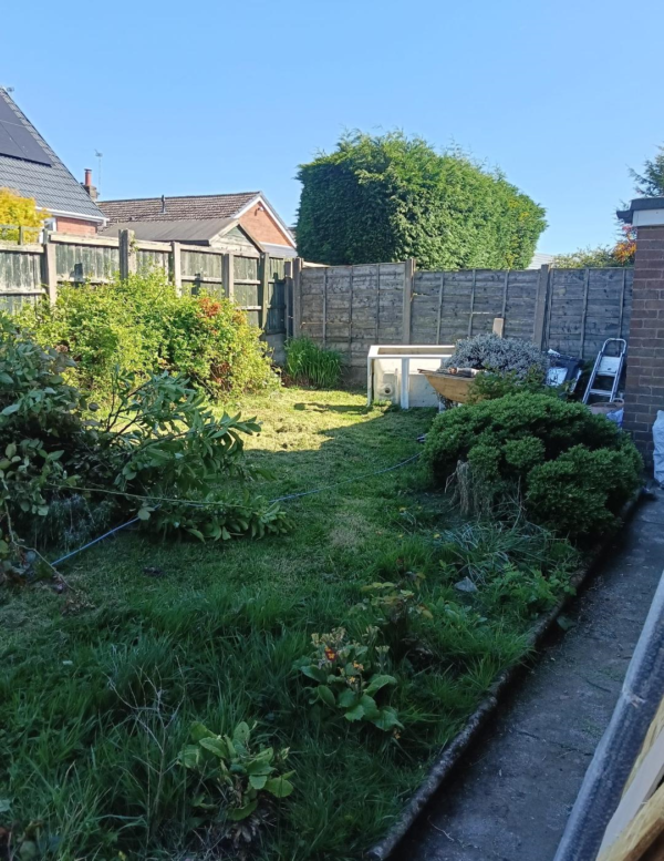 Overgrown Bolton garden before composite decking installation by Wolsten