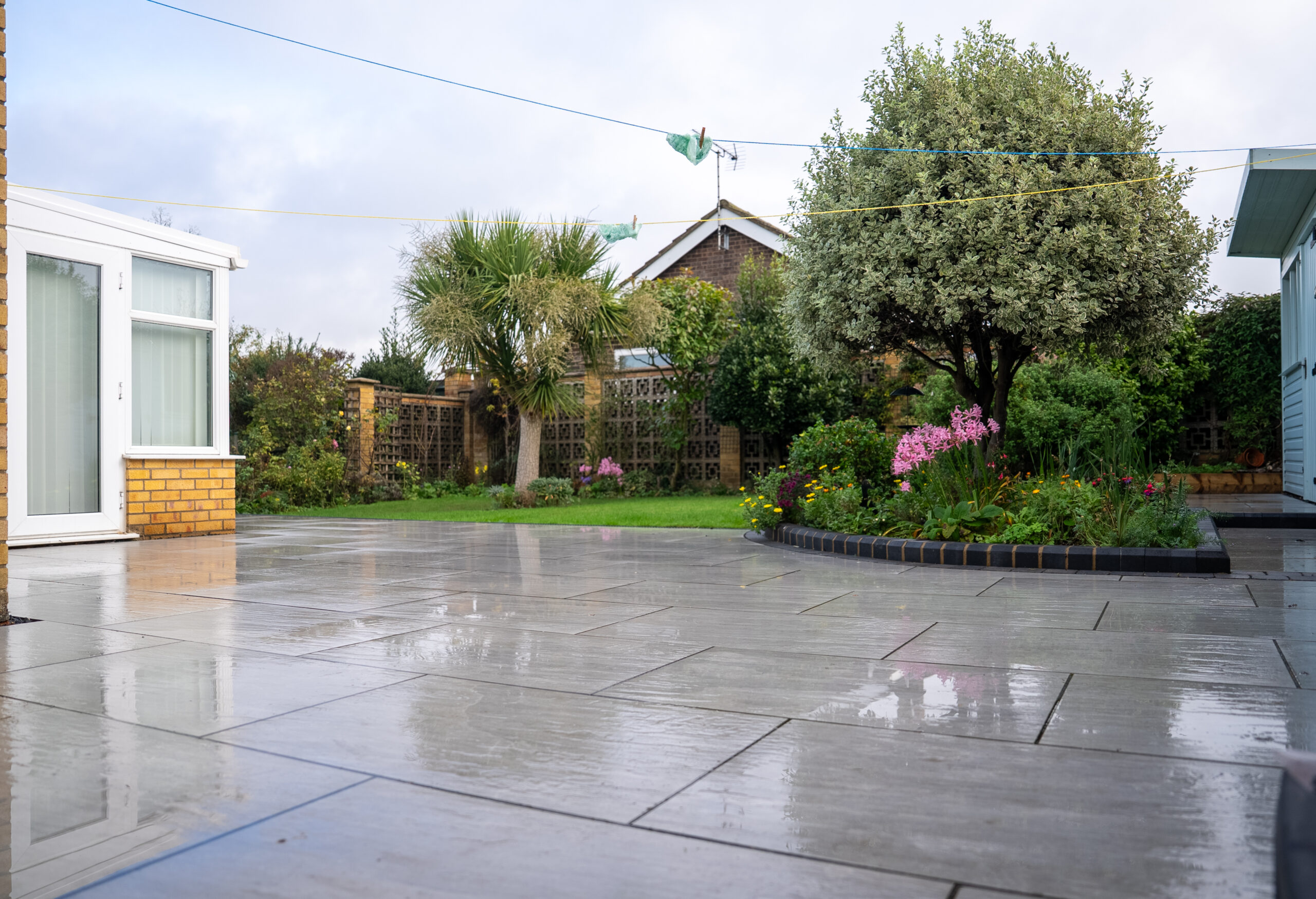 Dark grey porcelain patio installed by Wolsten in Bolton