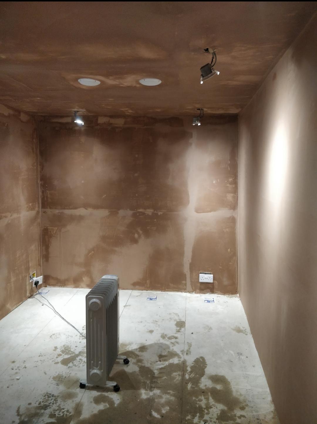 Mid-build -- fresh plaster, first-fix electrics, downlights wired