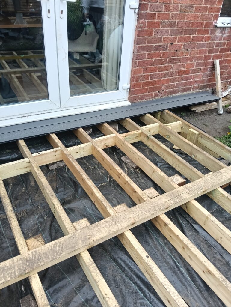 Completed 6x2 pressure-treated timber decking sub-frame in Bolton