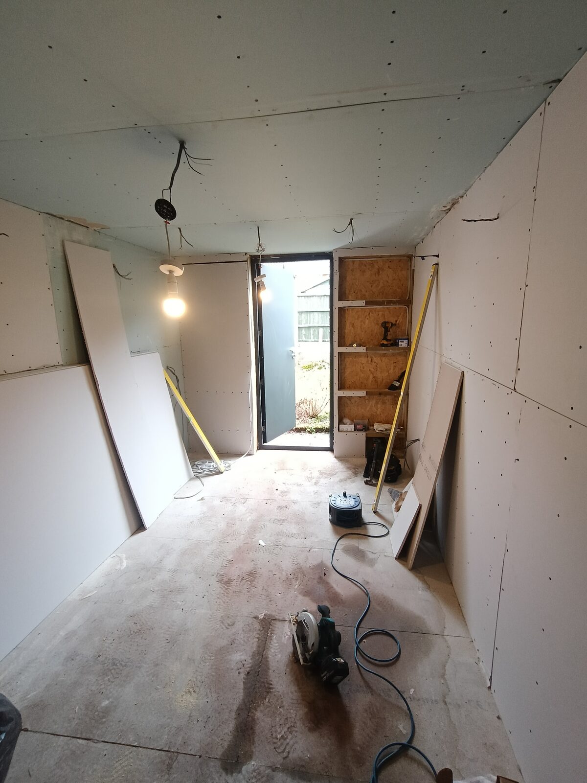 Over Hulton garage plastered with recessed downlights