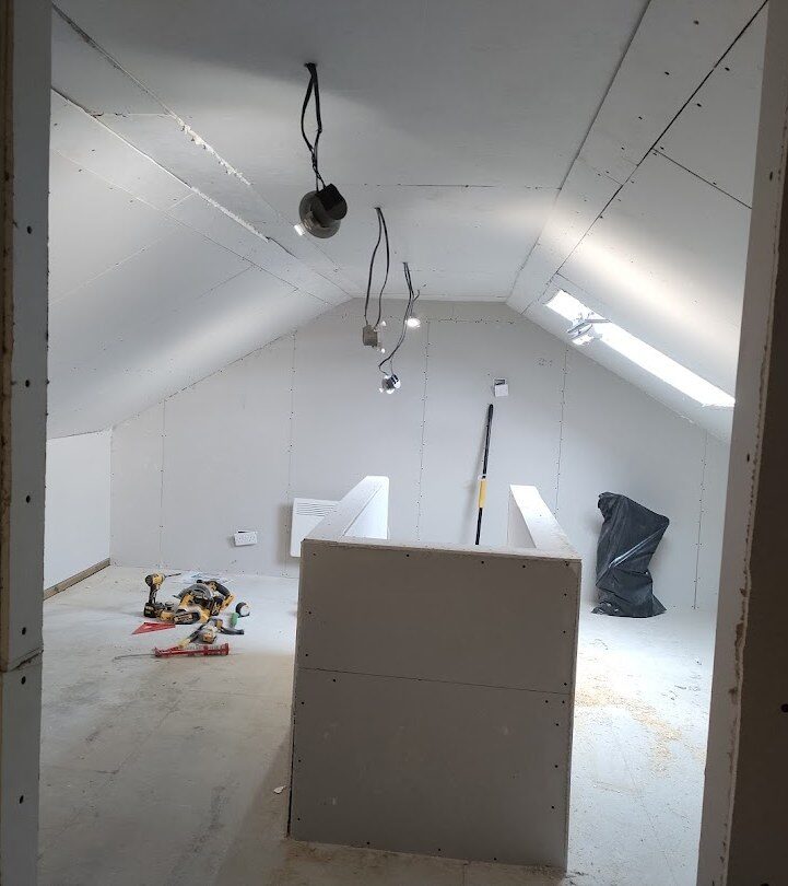 Bolton loft plastered with recessed downlights