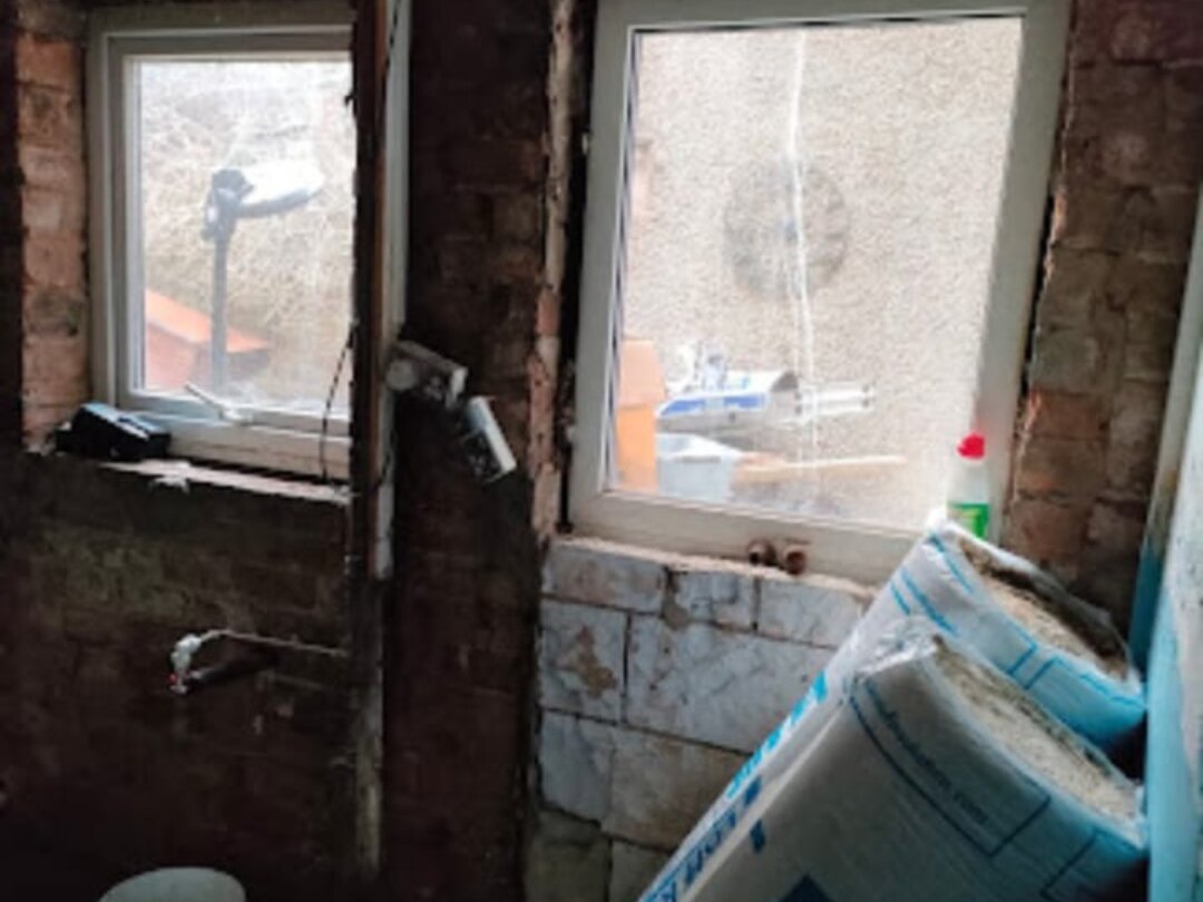 Damp proofing in Bolton — walls stripped back ready for treatment